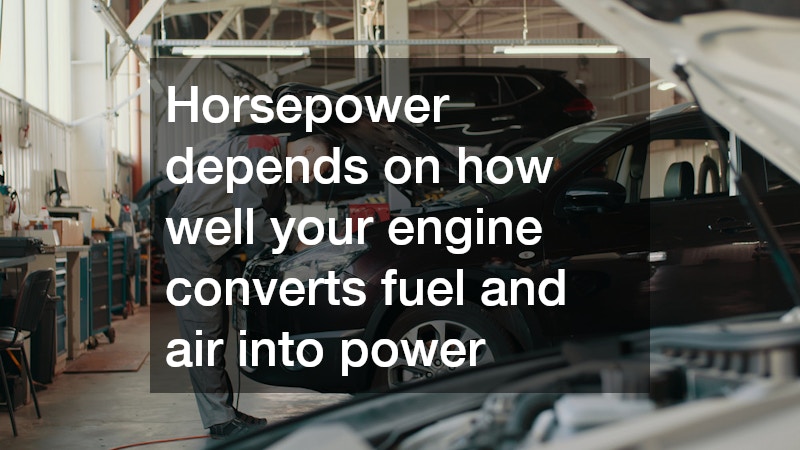 auto mechanic fixing a black car's engine